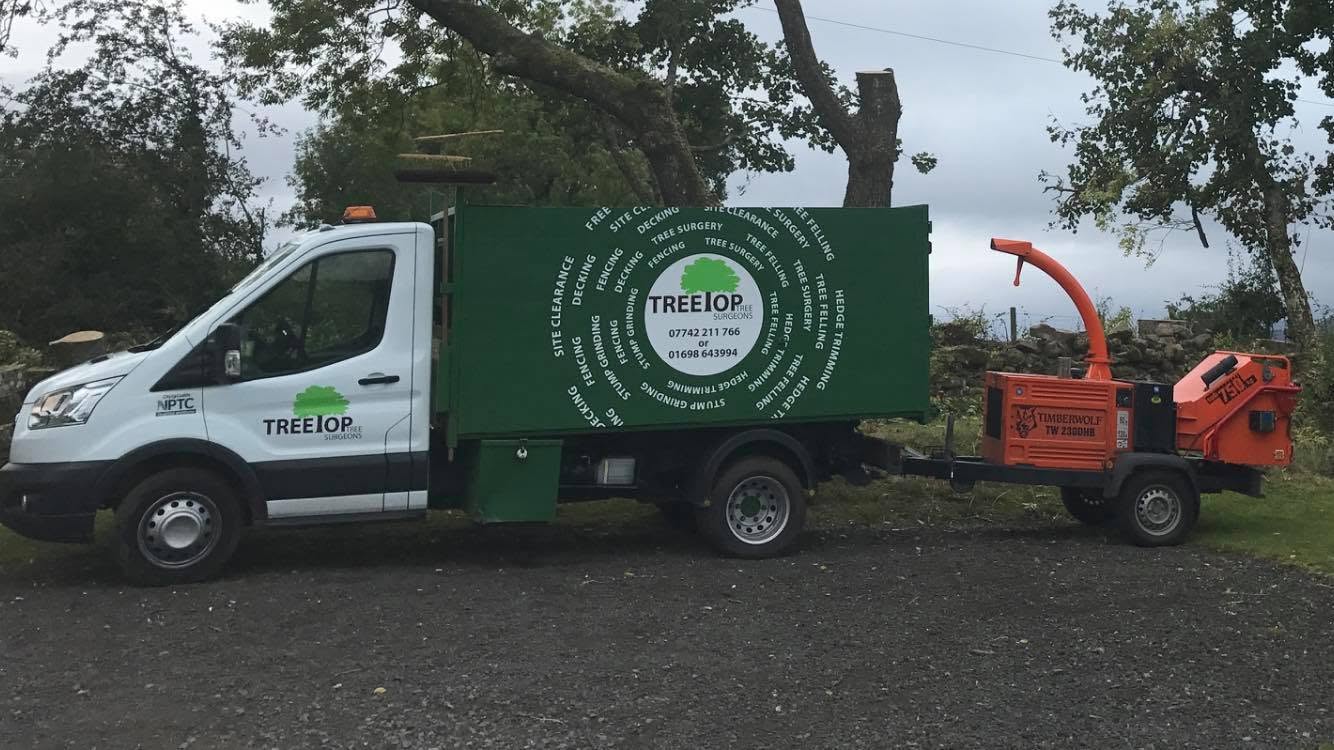 Treetop branded tipper truck with a Timberwolf wood chipper